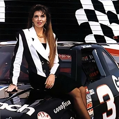 Teresa Earnhardt sitting on top of a car used during a NASCAR race.
